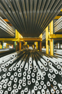 Close-up of steel pipes in factory