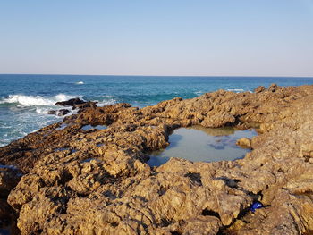 Scenic view of sea against clear sky