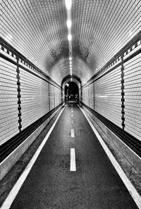 Man in illuminated tunnel