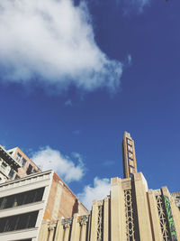 Low angle view of buildings against blue sky