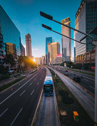 View of city street and buildings against sky