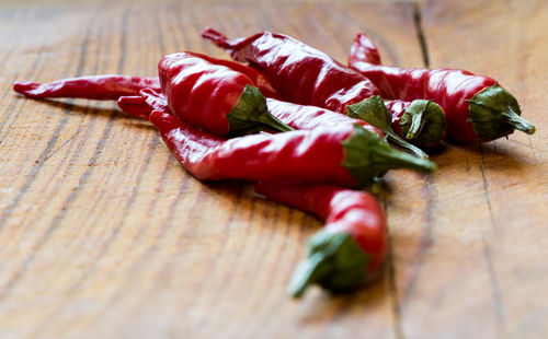 High angle view of red chili peppers on table