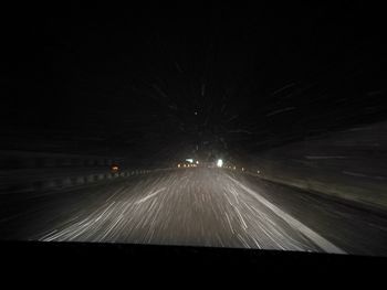 Illuminated road at night