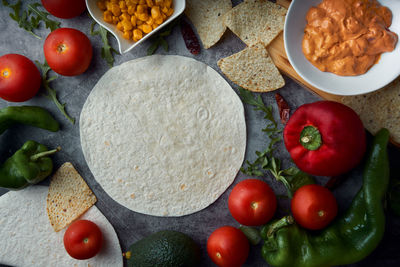 Preparing mexican fajitas with cakes, tomato, pepper, spicy and meat. concept of mexican food