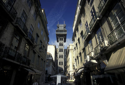 Low angle view of santa justa lift amidst buildings in city