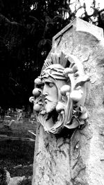 Low angle view of statue against trees