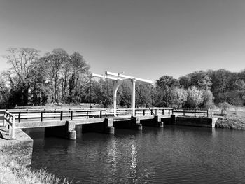 Bridge over river against clear sky