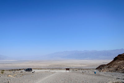 Scenic view of mountains against clear blue sky