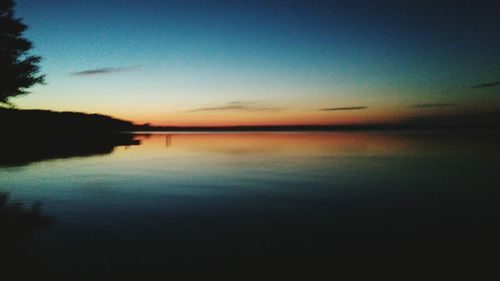 Scenic view of calm sea at sunset