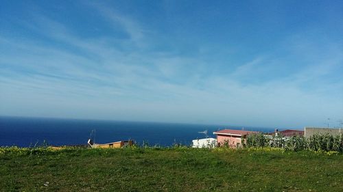 Scenic view of sea against blue sky