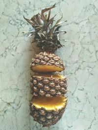 Close-up of fruits on table against wall