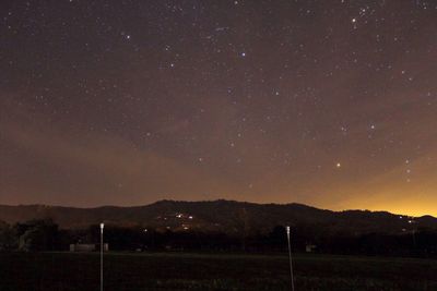 Scenic view of star field against sky at night