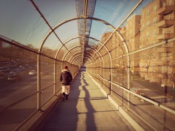 Woman walking in tunnel