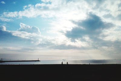 Scenic view of sea against cloudy sky