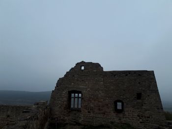 Low angle view of historic building against clear sky