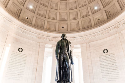 Low angle view of statue in the ceiling