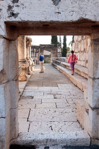 People in front of built structure