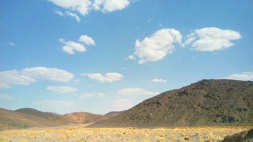 Scenic view of mountains at sahara desert against sky