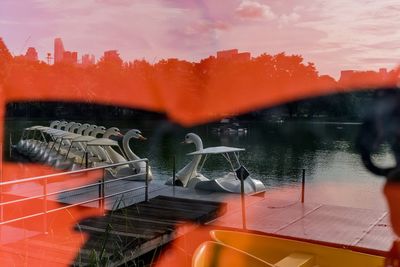 Digital composite image of car against sky during sunset