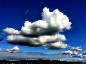 Scenic view of landscape against blue sky