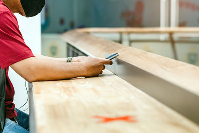 Man working on wooden table