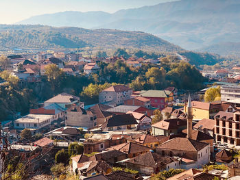 High angle view of townscape and mountains