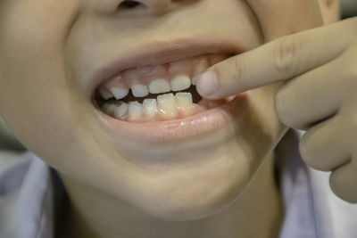 Close-up of smiling mid adult man in mouth open