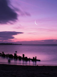 Scenic view of sea against sky at sunset