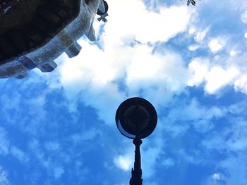 Low angle view of building against cloudy sky