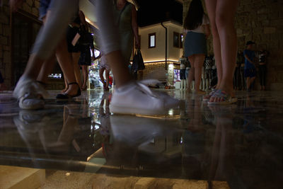 Low section of people walking at night