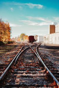 Train tracks and a boxcar on a beautiful autumn day