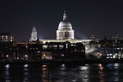 Illuminated building against sky at night