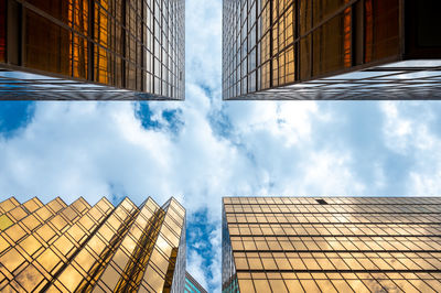 Low angle view of modern buildings against sky