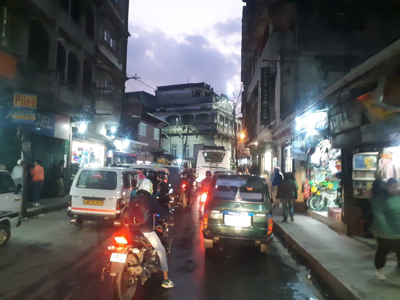 CARS ON CITY STREET DURING RAINY DAY