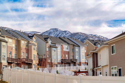 Houses against sky in city