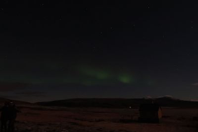 Scenic view of landscape against sky at night