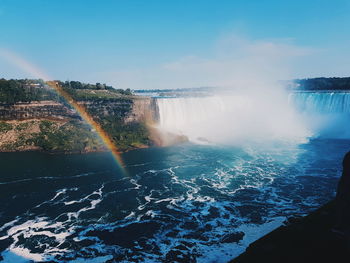 Scenic view of rainbow over sea. niagara falls.