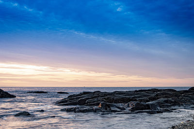 Scenic view of sea against sky during sunset