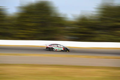 Blurred motion of car on road