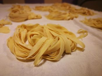 High angle view of pasta with bread on table