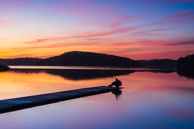 Scenic view of lake against sky during sunset