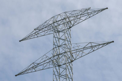 Low angle view of electricity pylon