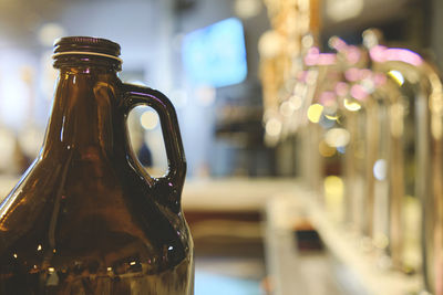 Bottle beer and micro brew or draft beer taps, row of draft beer taps at a bar. selective focus. 