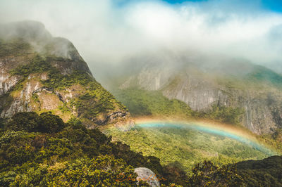 Scenic view of rainbow over mountain