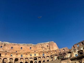 Low angle view of airplane flying in sky