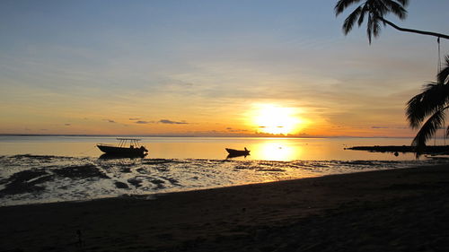 Scenic view of sea at sunset