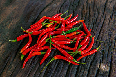 Close-up of red chili peppers on table