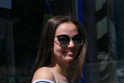 Portrait of young woman wearing sunglasses