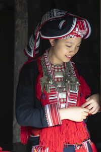 Portrait of girl wearing hat standing outdoors