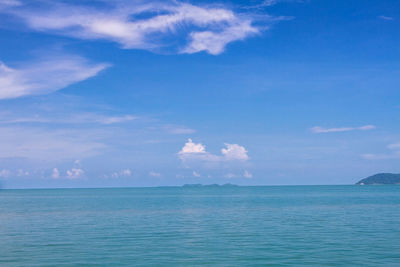 Scenic view of sea against blue sky